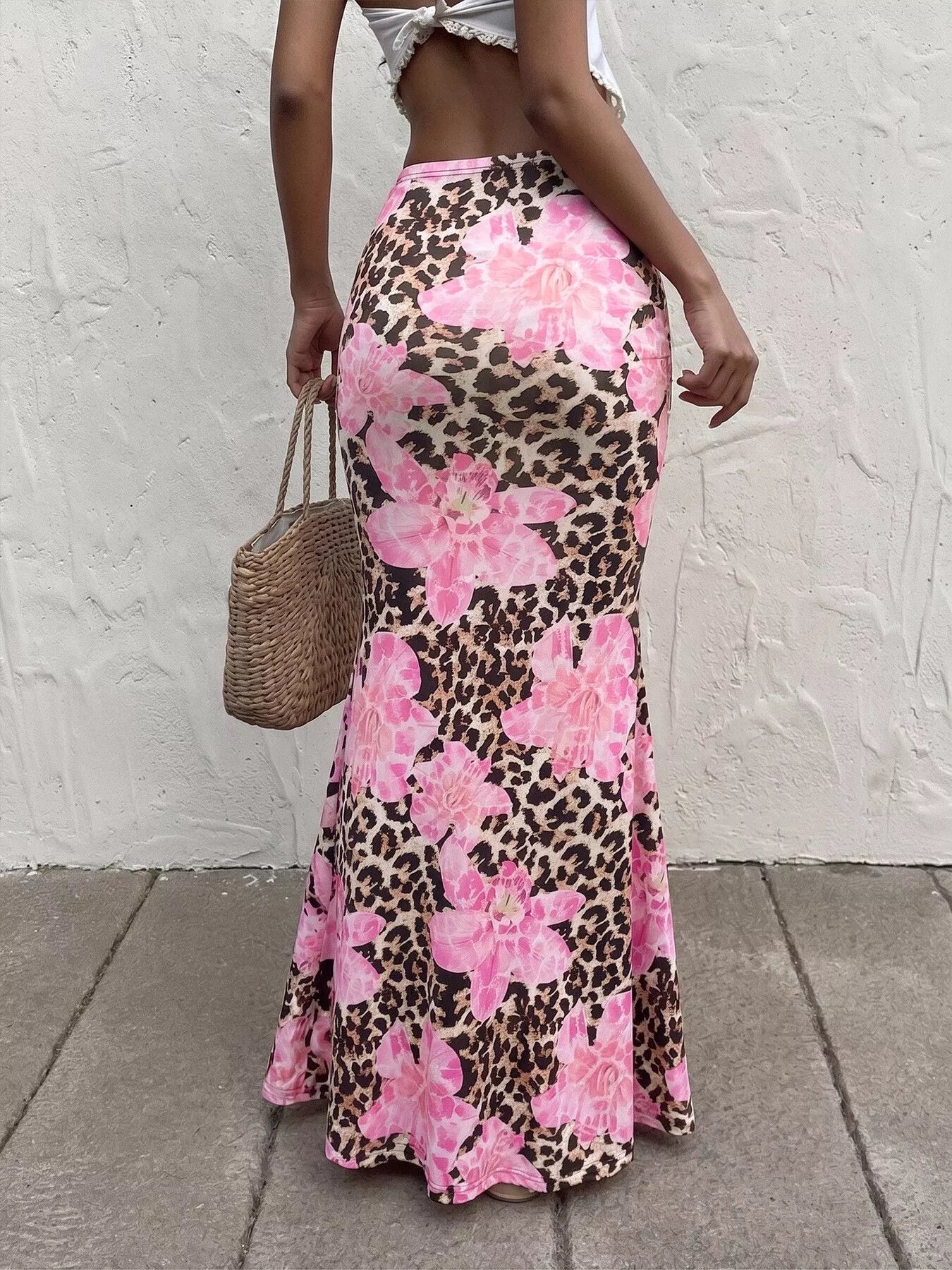 Blush pink leopard print bodycon maxi skirt from Trendsi, featuring a fitted silhouette and bold animal pattern.