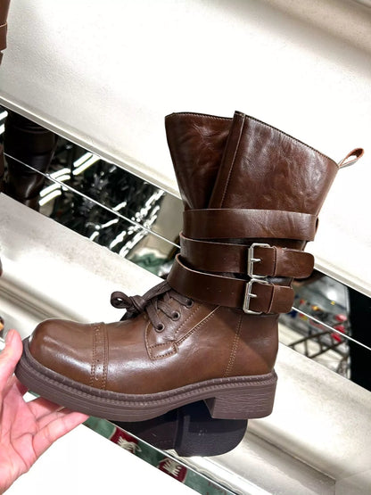 Brown buckled leather block heel boots by Trendsi, featuring a stylish design with buckle accents and sturdy heel.