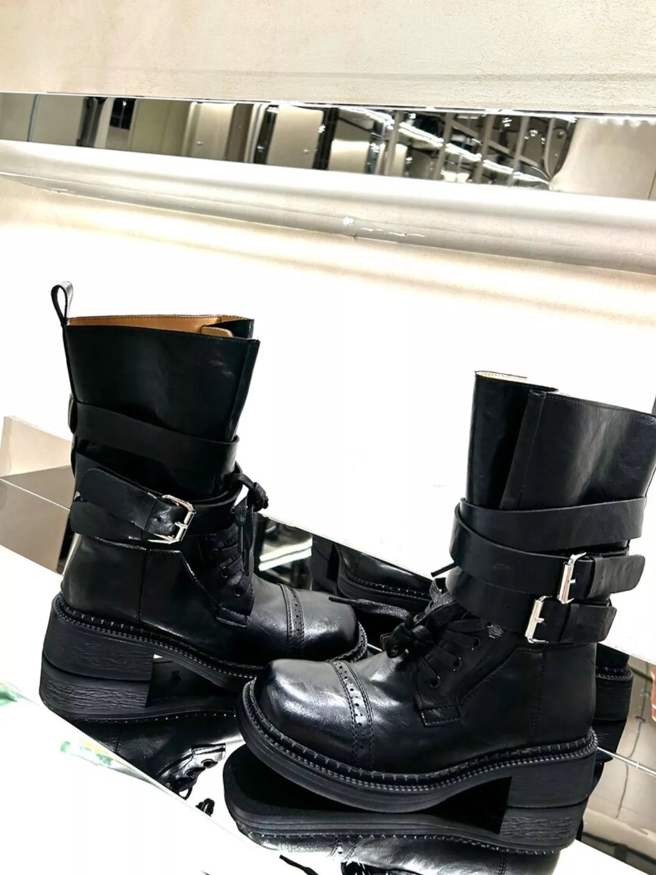 Brown buckled leather block heel boots with adjustable straps and sturdy heel, stylish footwear by Trendsi.