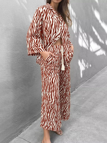 Zebra print relaxed fit top and pants two-piece set by Trendsi, featuring bold black and white animal print fabric.