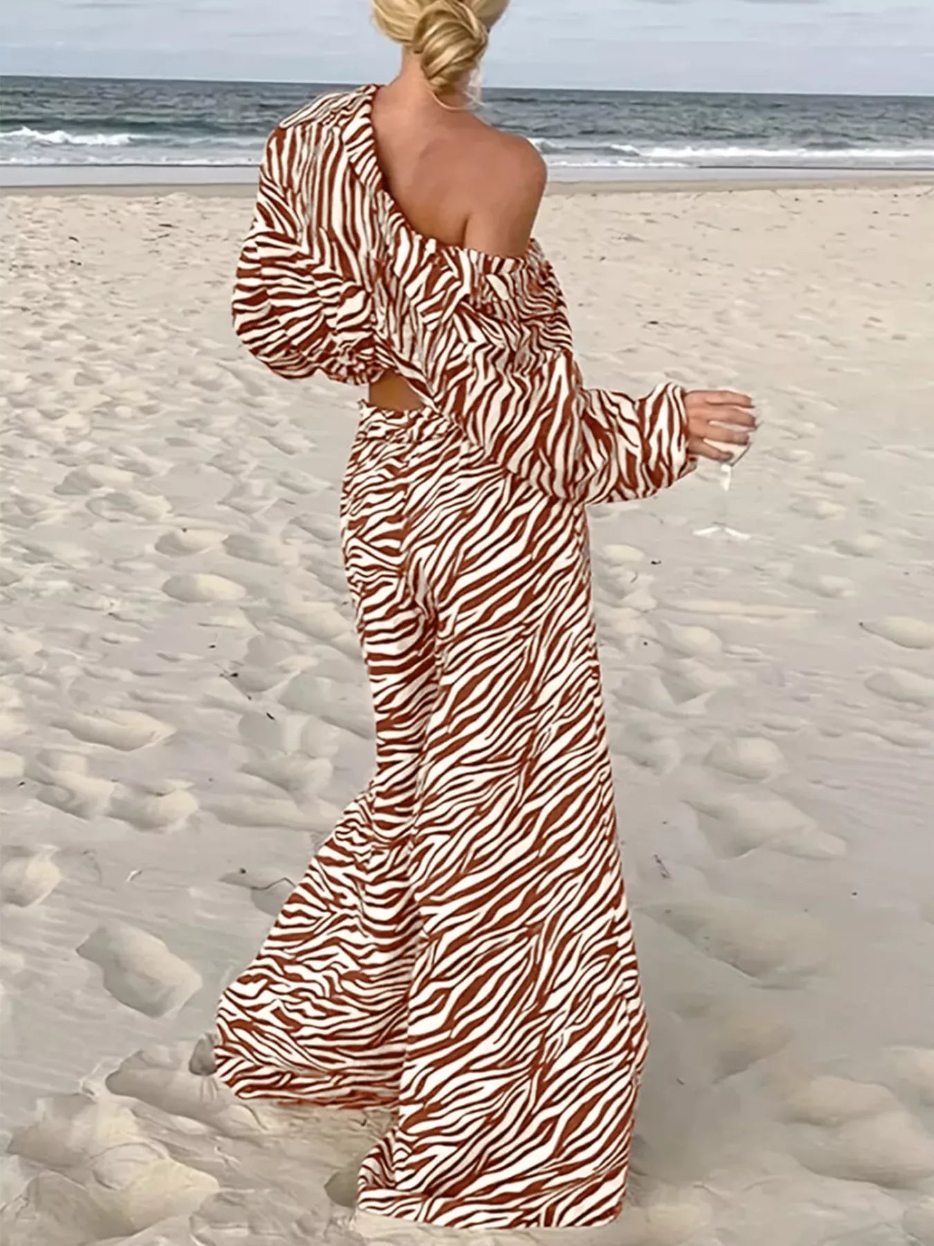 Zebra print relaxed fit top and pants two-piece set from Trendsi, showing the comfortable, stylish matching outfit with bold animal print.