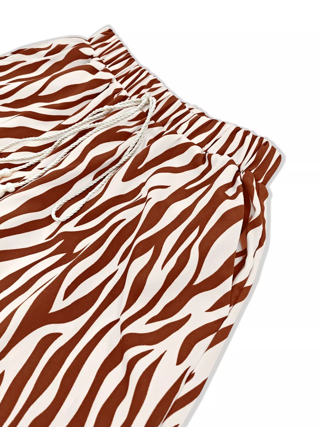Zebra print relaxed fit two-piece top and pants set by Trendsi, featuring bold animal print and comfortable casual style.