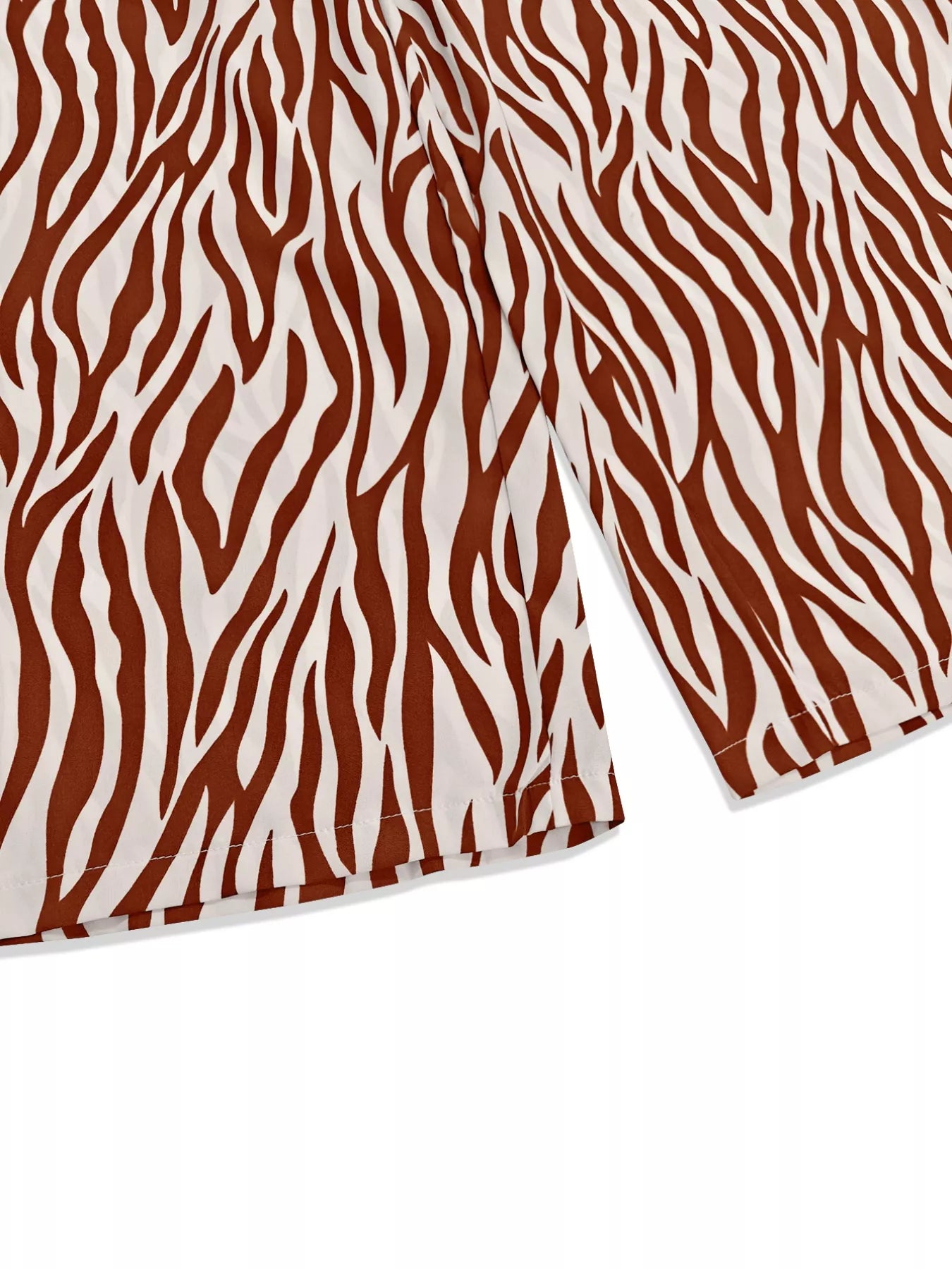Zebra print relaxed fit top and pants two-piece set by Trendsi, featuring comfortable casual style with bold black and white patterns.