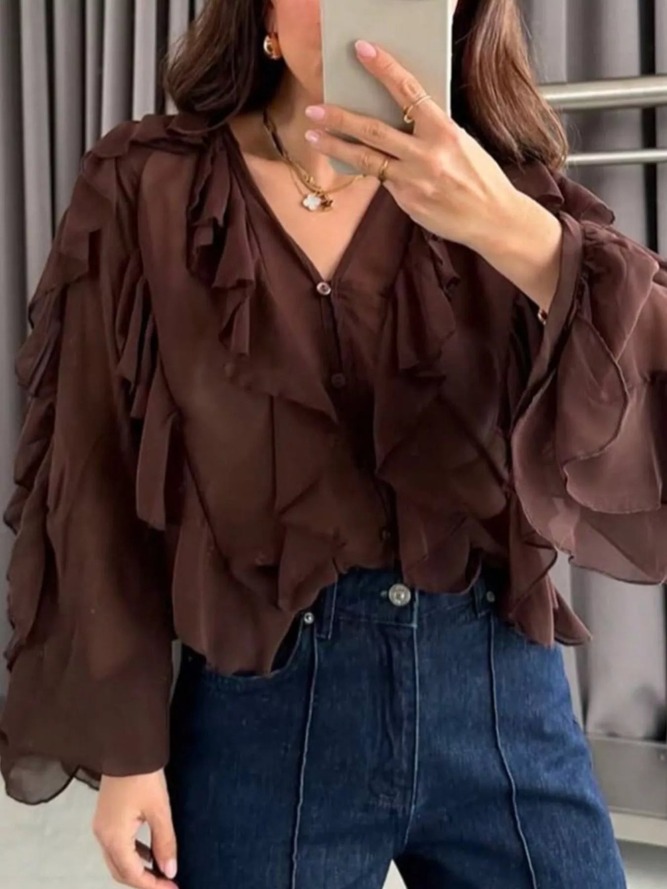Sheer long sleeve blouse with ruffled details in white from Trendsi, featuring a delicate, feminine design.