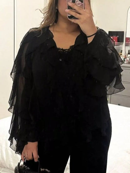 Ruffled sheer long sleeve blouse by Trendsi featuring delicate fabric, feminine ruffles, and a stylish, elegant design.
