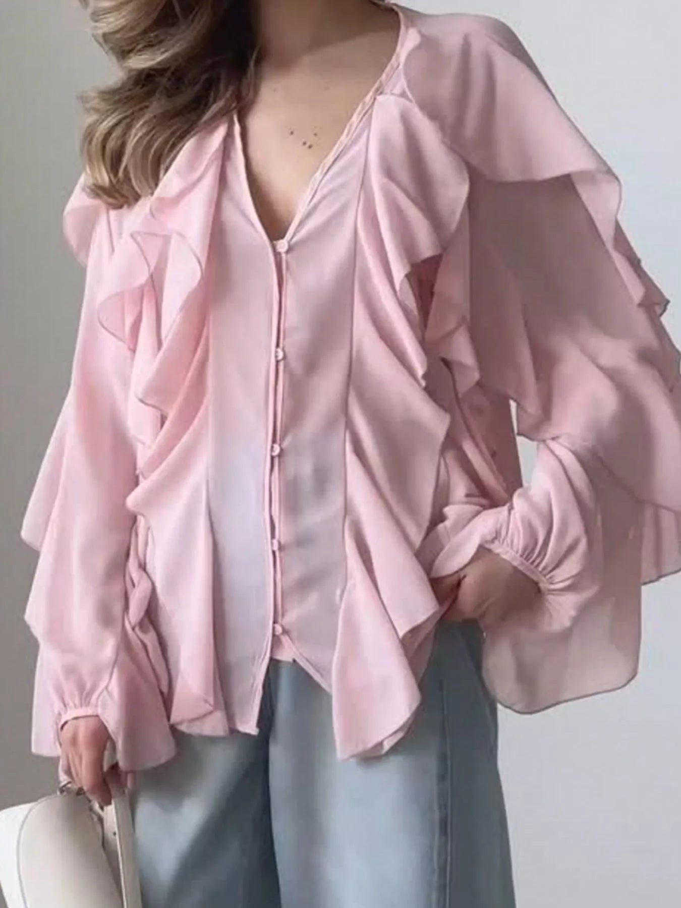 Sheer long sleeve blouse with ruffled details, stylish and lightweight, from Trendsi, perfect for elegant casual or dressy wear.