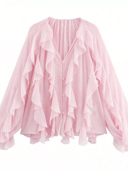 Sheer long sleeve blouse with ruffled details from Trendsi, featuring a delicate, flowy design and feminine style.
