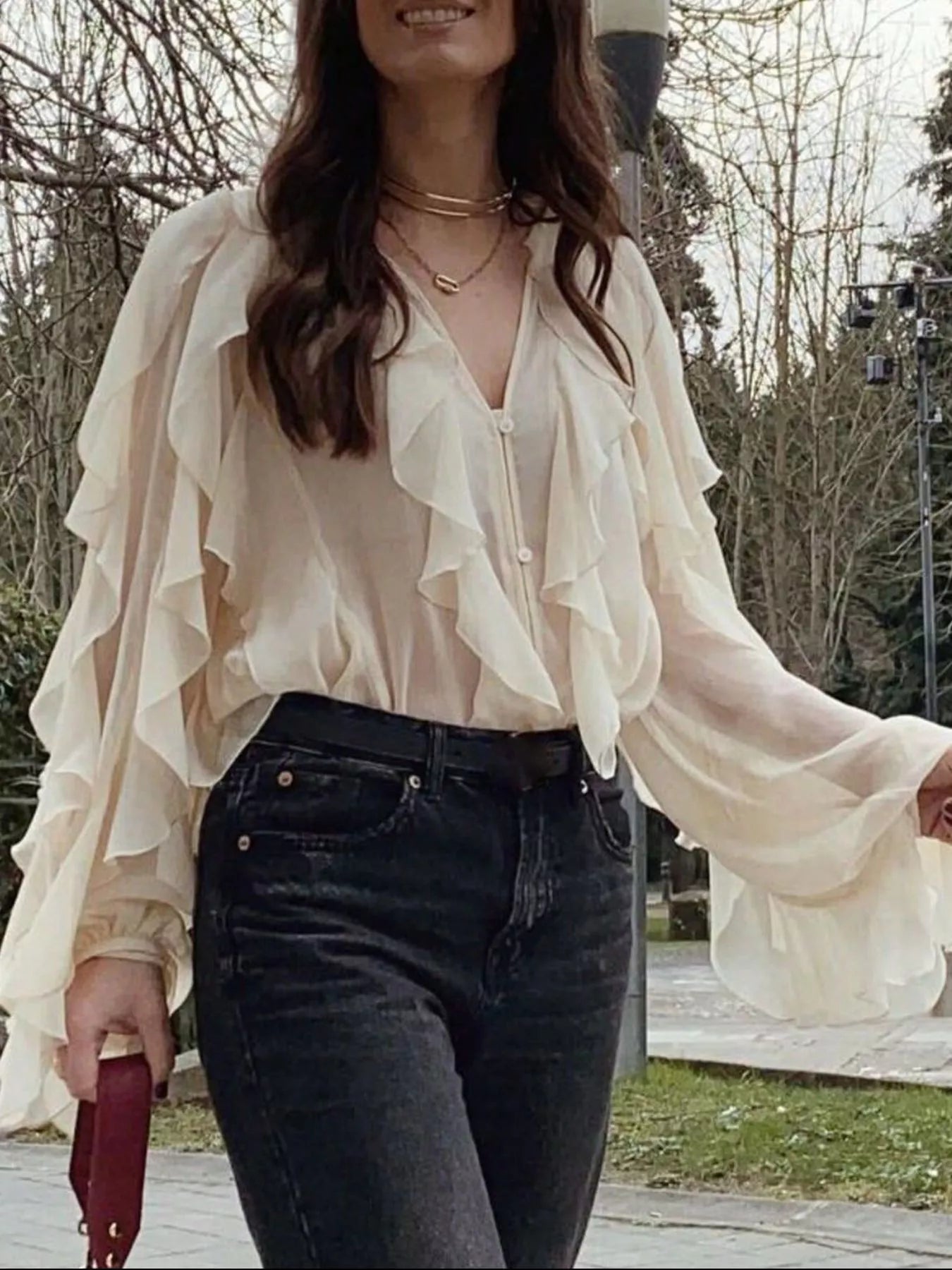 Brown ruffled sheer long sleeve blouse from Trendsi, featuring delicate ruffle details and a lightweight, semi-transparent fabric.