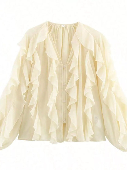 Brown ruffled sheer long sleeve blouse by Trendsi, featuring delicate fabric and elegant ruffle details.