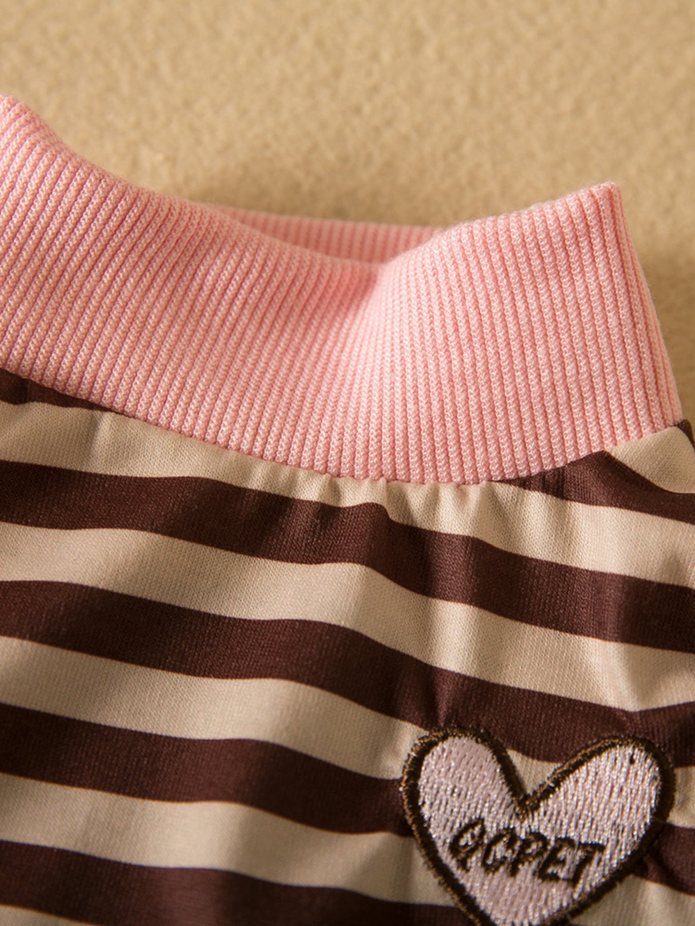 Brown striped heart patch pet top from Trendsi, featuring a cute heart design on a comfortable fabric shirt for pets.