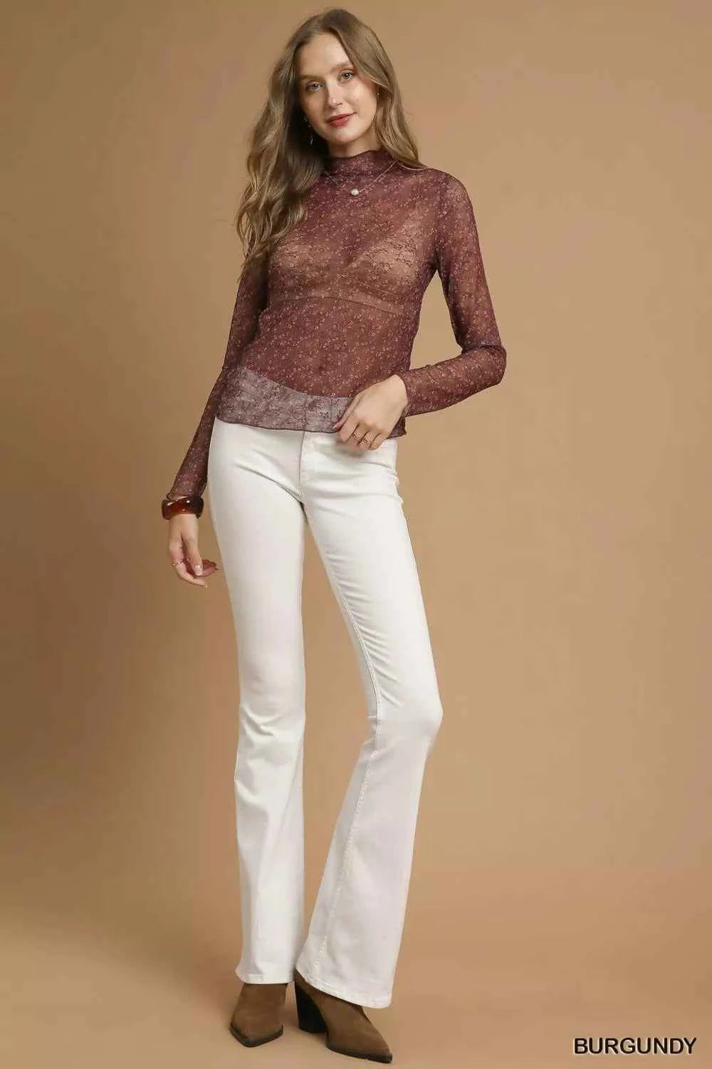 Navy blue Umgee nylon lace mesh long sleeve top with floral lace details and a fitted silhouette.