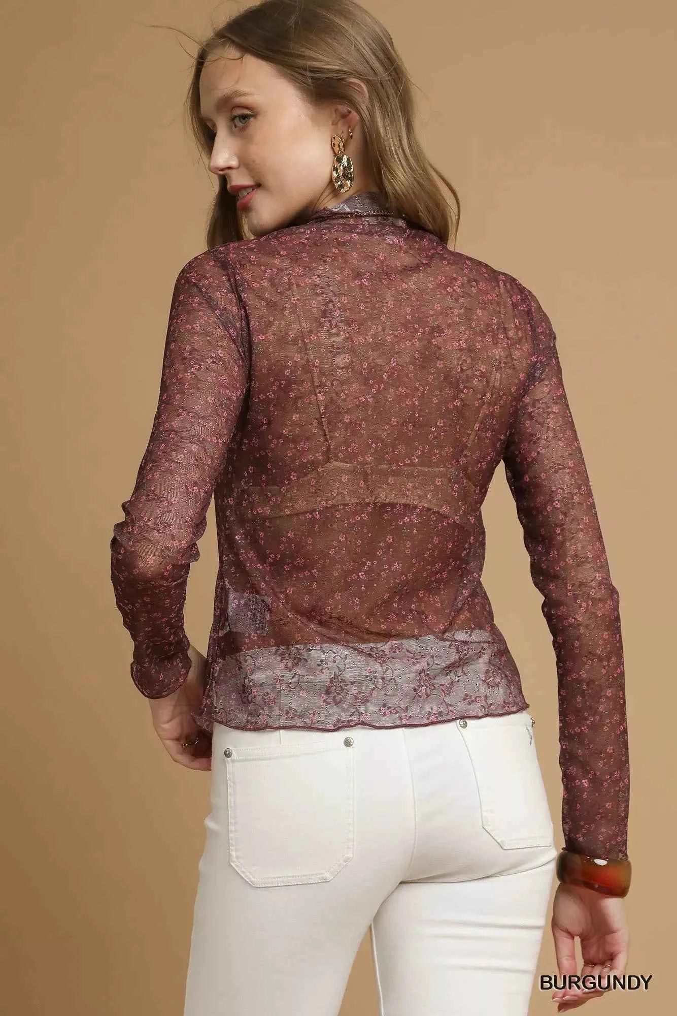 Umgee nylon lace mesh long sleeve top featuring delicate lace details and a fitted long sleeve design.