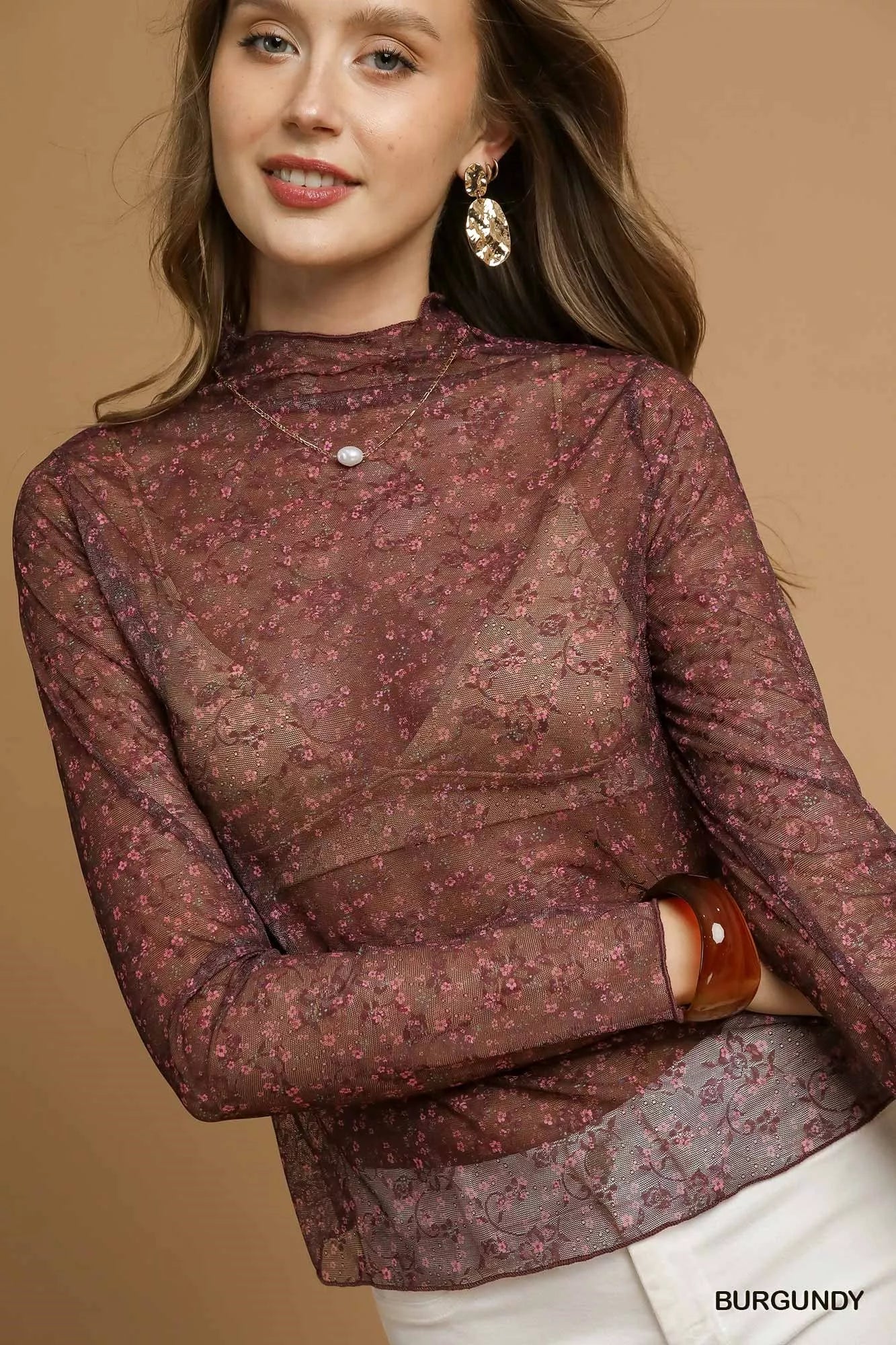 Umgee nylon lace mesh long sleeve top with intricate lace details and sheer mesh fabric, stylish and trendy for modern fashion.