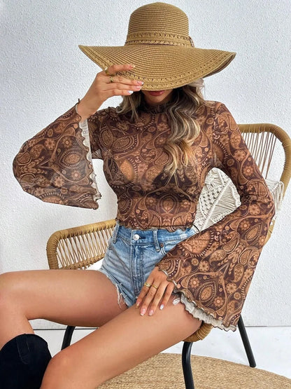 Printed mock neck long sleeve cropped T-shirt by Trendsi in camel color, featuring a stylish design and fitted silhouette.