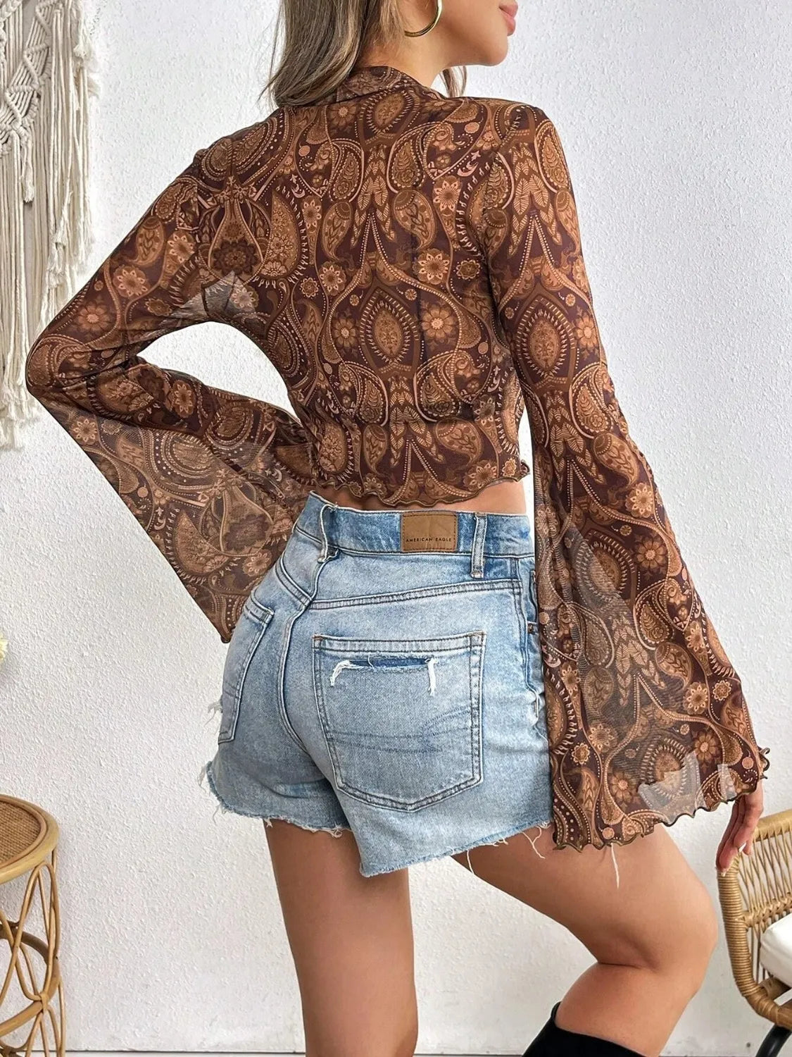Camel printed mock neck long sleeve cropped T-shirt by Trendsi, featuring a fitted style and comfortable fabric.