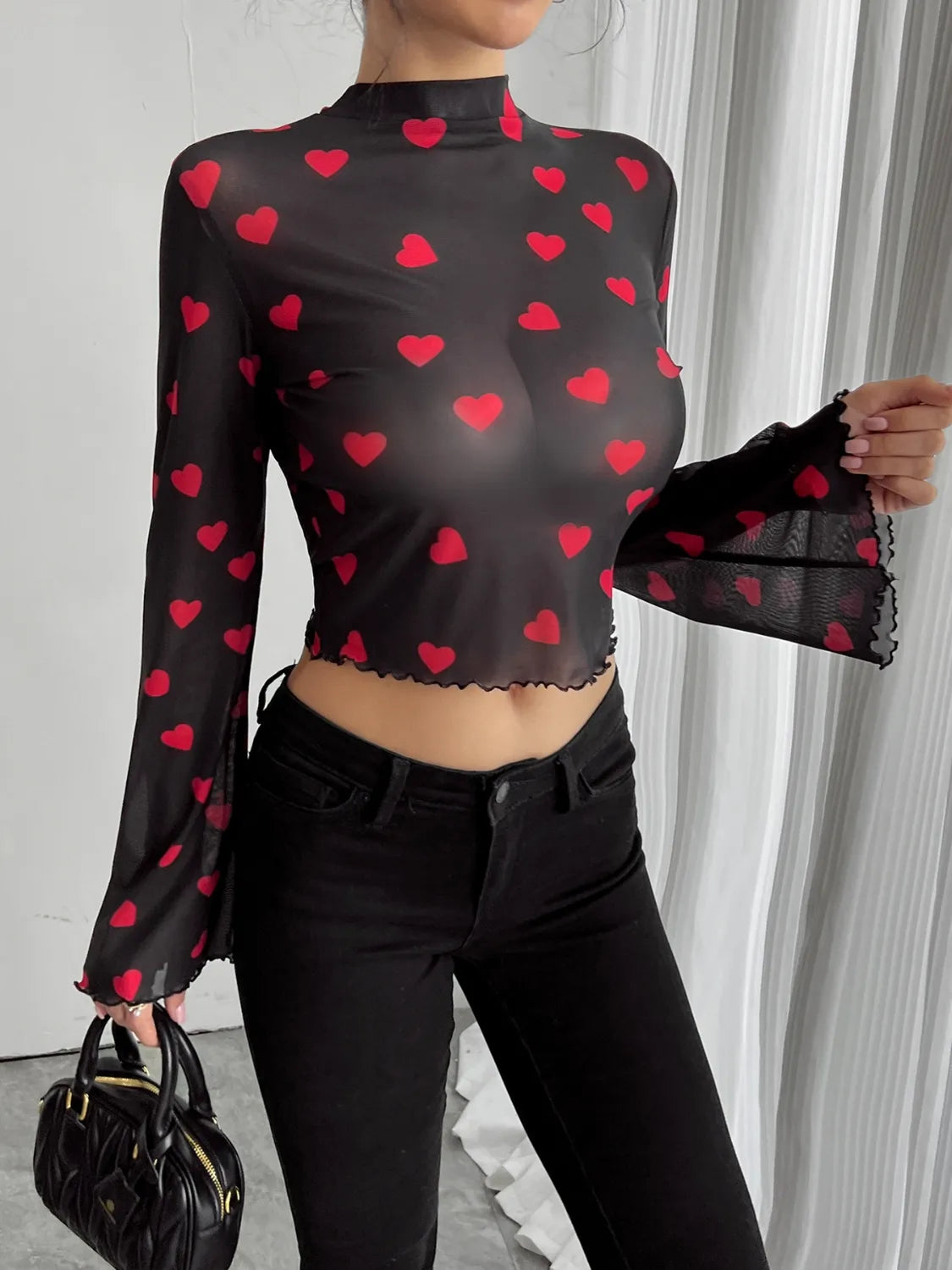Camel-colored printed mock neck long sleeve cropped T-shirt by Trendsi, featuring a fitted design and stylish graphic print.