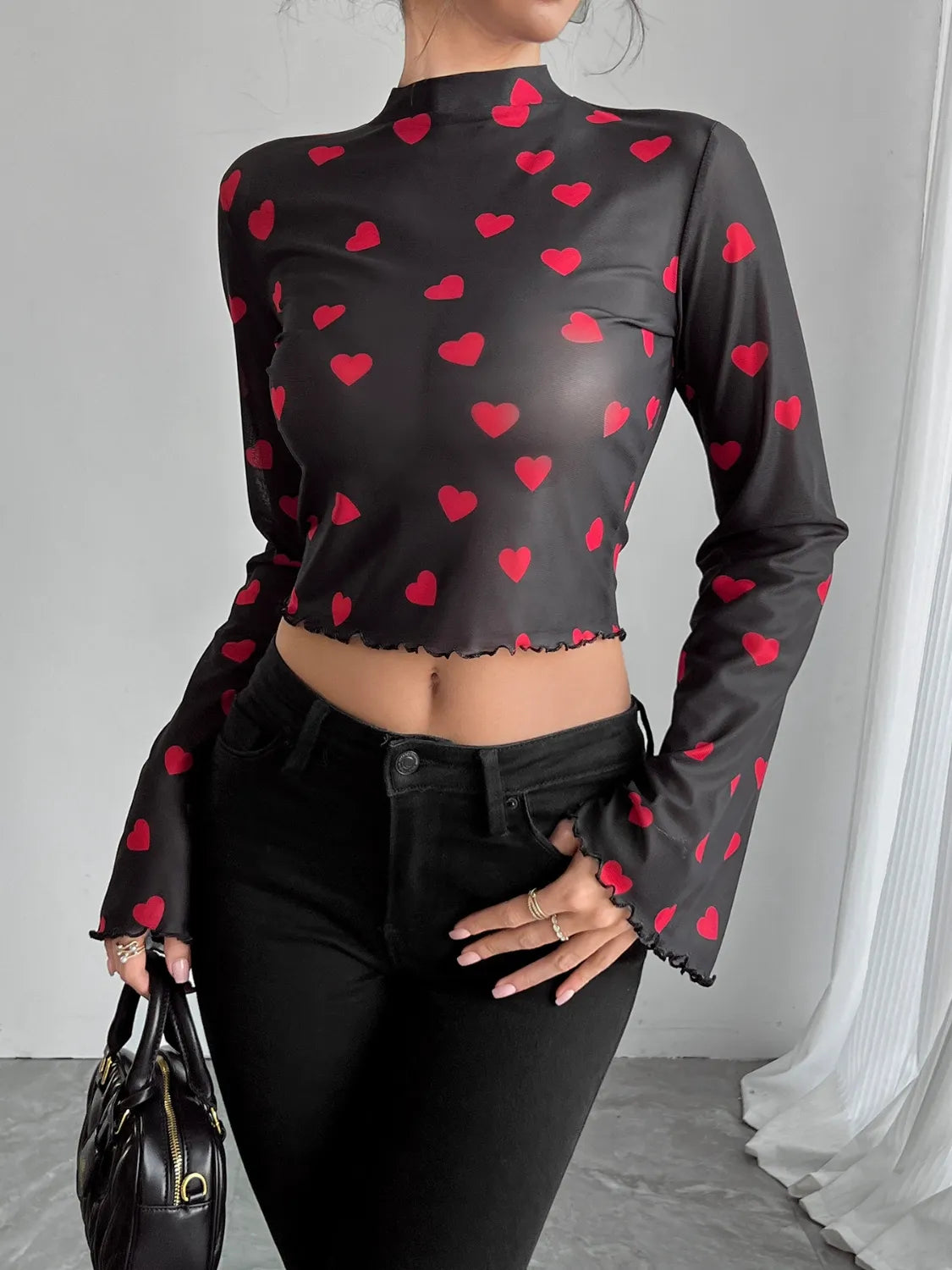 Camel printed mock neck long sleeve cropped T-shirt by Trendsi, showcasing a fitted design with a stylish pattern.