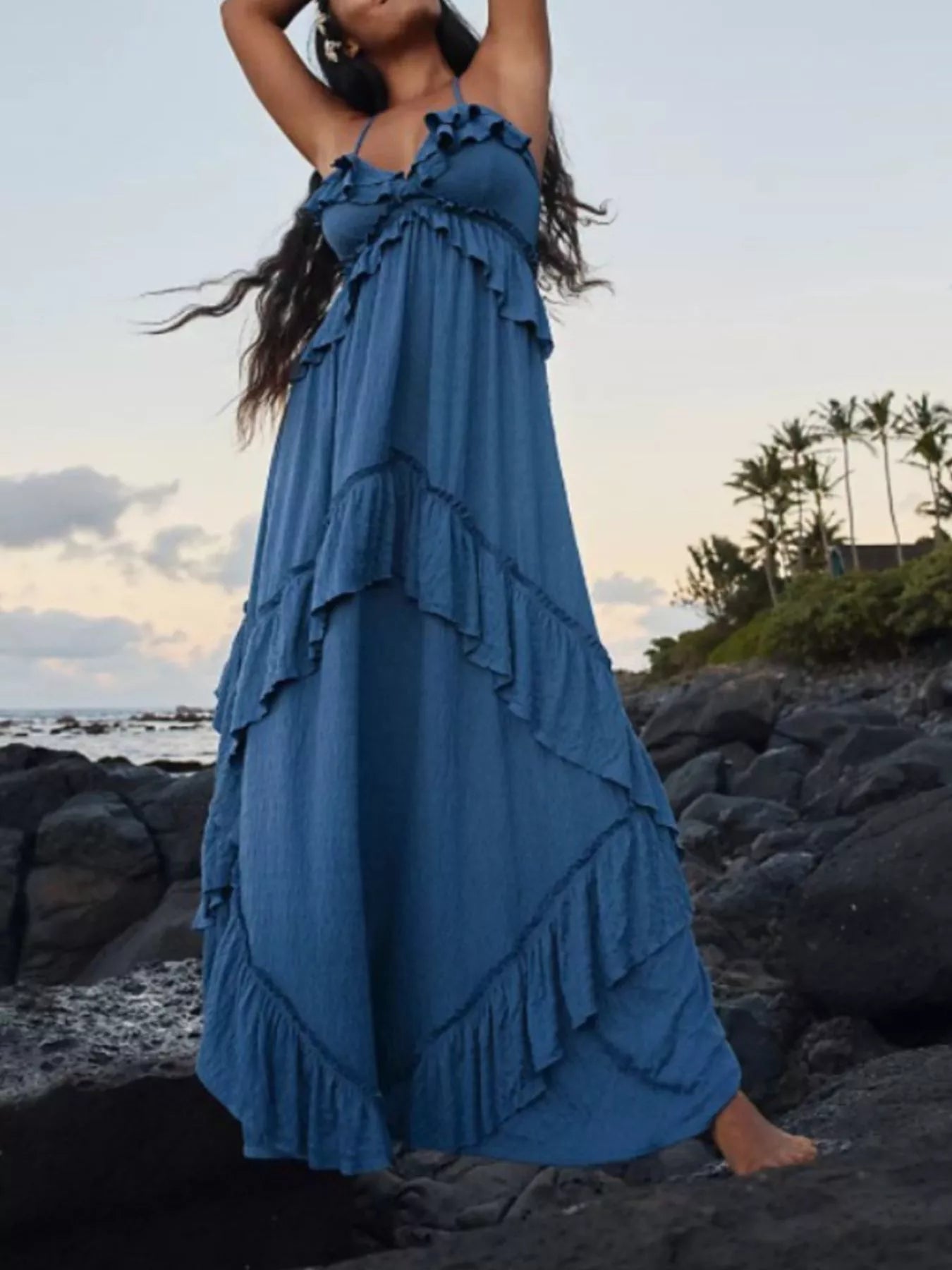 Ruffled halter neck maxi dress by Trendsi featuring a flowy design with ruffled details and a flattering halter neckline.