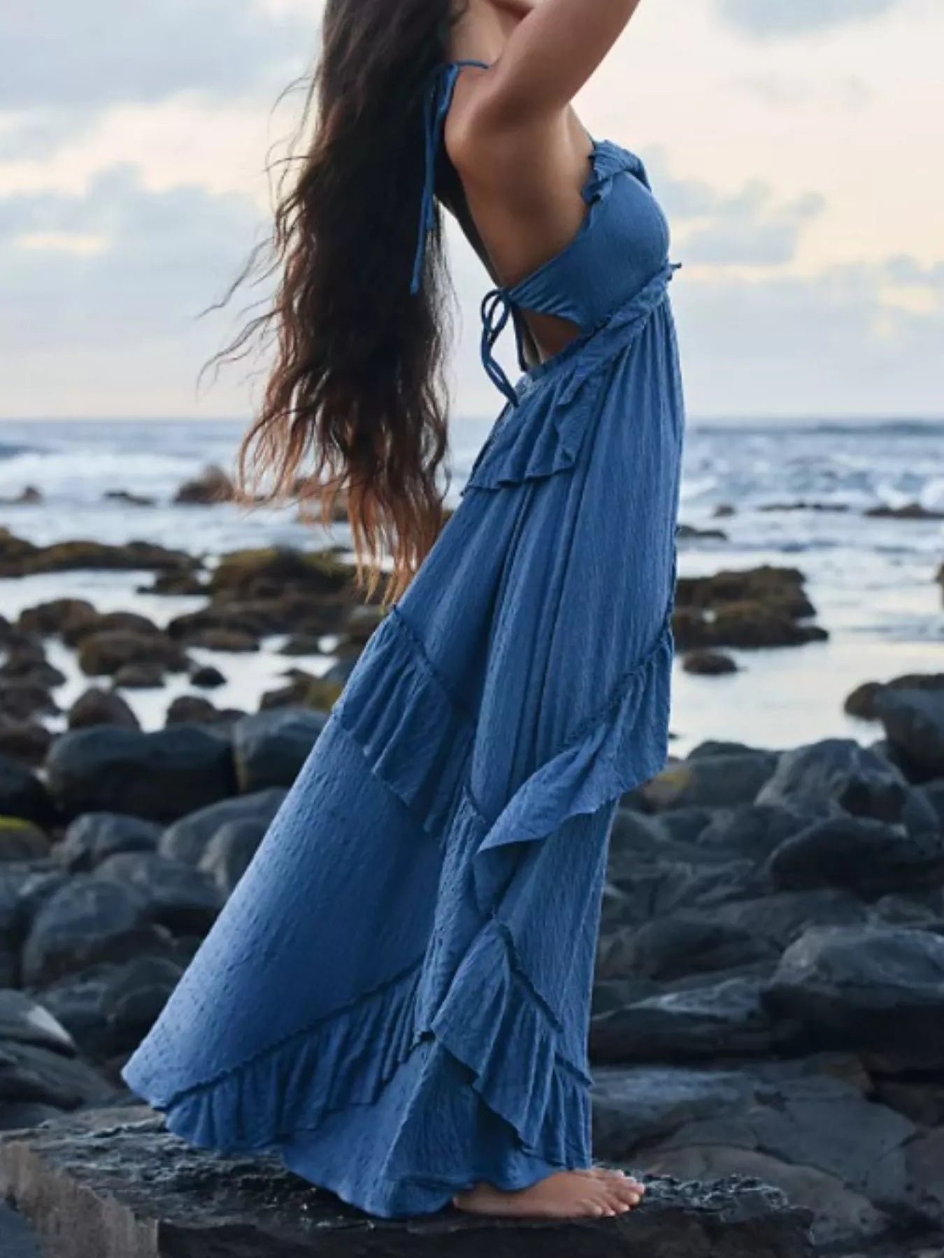 Ruffled halter neck maxi dress by Trendsi featuring flowing fabric and a stylish ruffled neckline.
