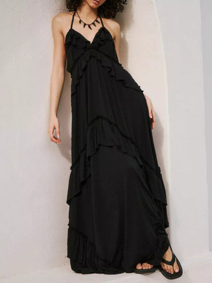Ruffled halter neck maxi dress by Trendsi featuring flowing fabric and a stylish ruffled design for elegant summer wear.