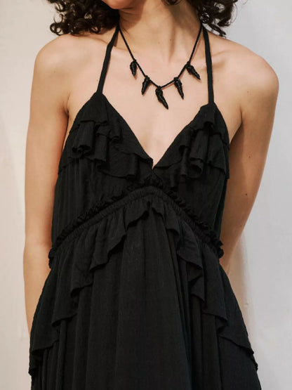 Ruffled halter neck maxi dress by Trendsi featuring flowing fabric and a stylish ruffled neckline.