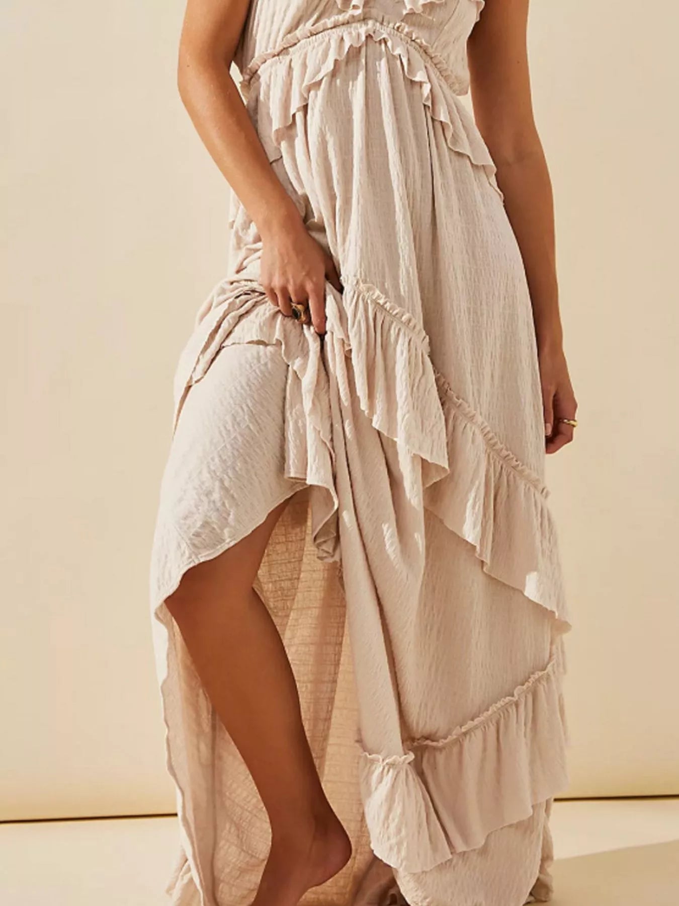 Ruffled halter neck maxi dress by Trendsi featuring flowing fabric and a stylish ruffled design, perfect for summer or events.