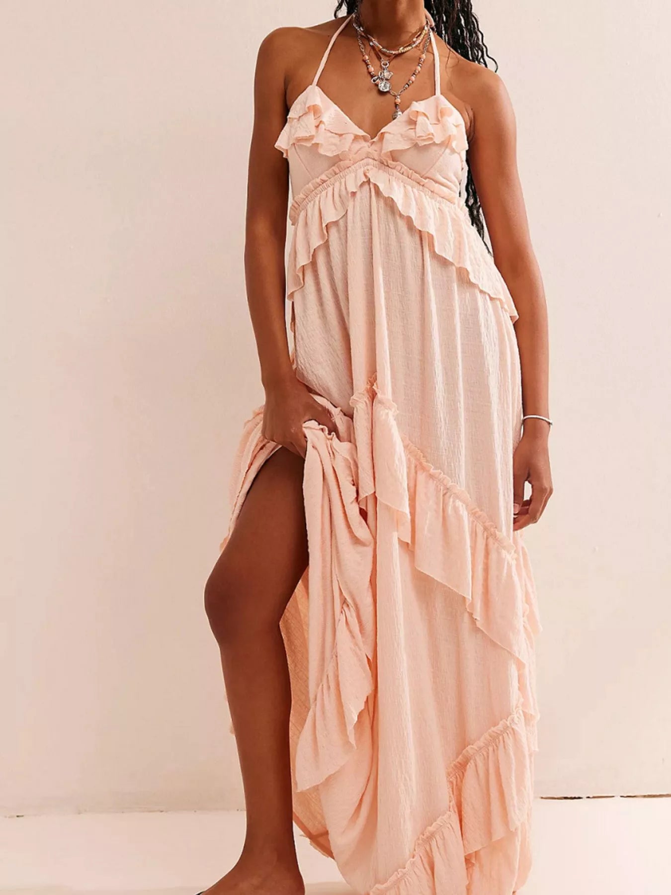 Ruffled halter neck maxi dress by Trendsi featuring flowing fabric and stylish ruffle details for elegant summer wear.