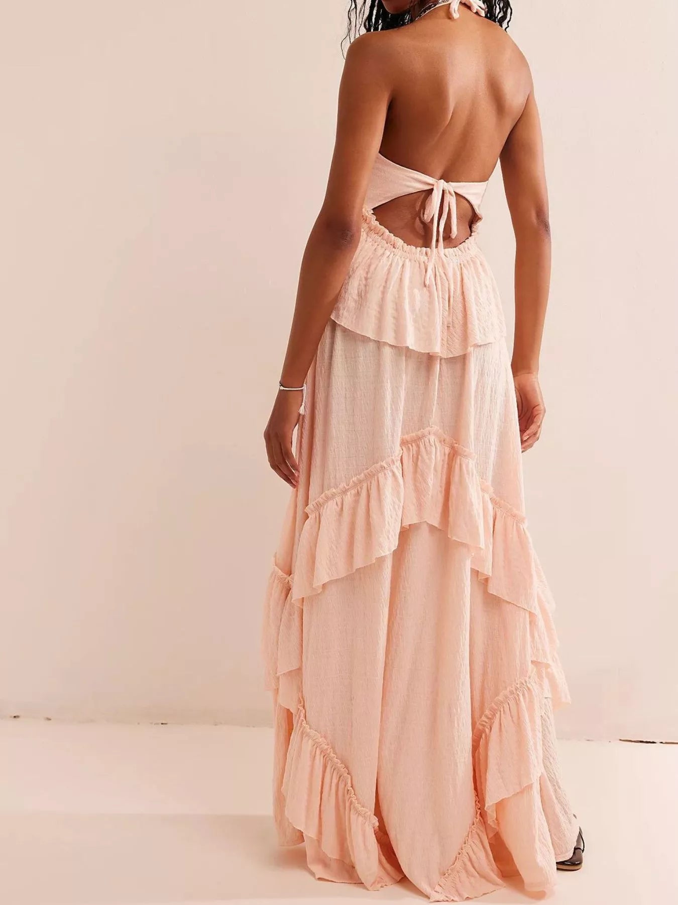 Ruffled halter neck maxi dress by Trendsi featuring flowing fabric, ruffle details, and a flattering silhouette for summer wear.