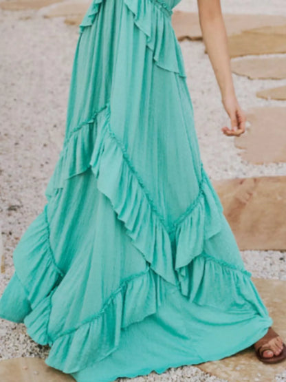 Ruffled halter neck maxi dress by Trendsi, featuring flowing fabric and a stylish ruffled neckline for elegant summer wear.