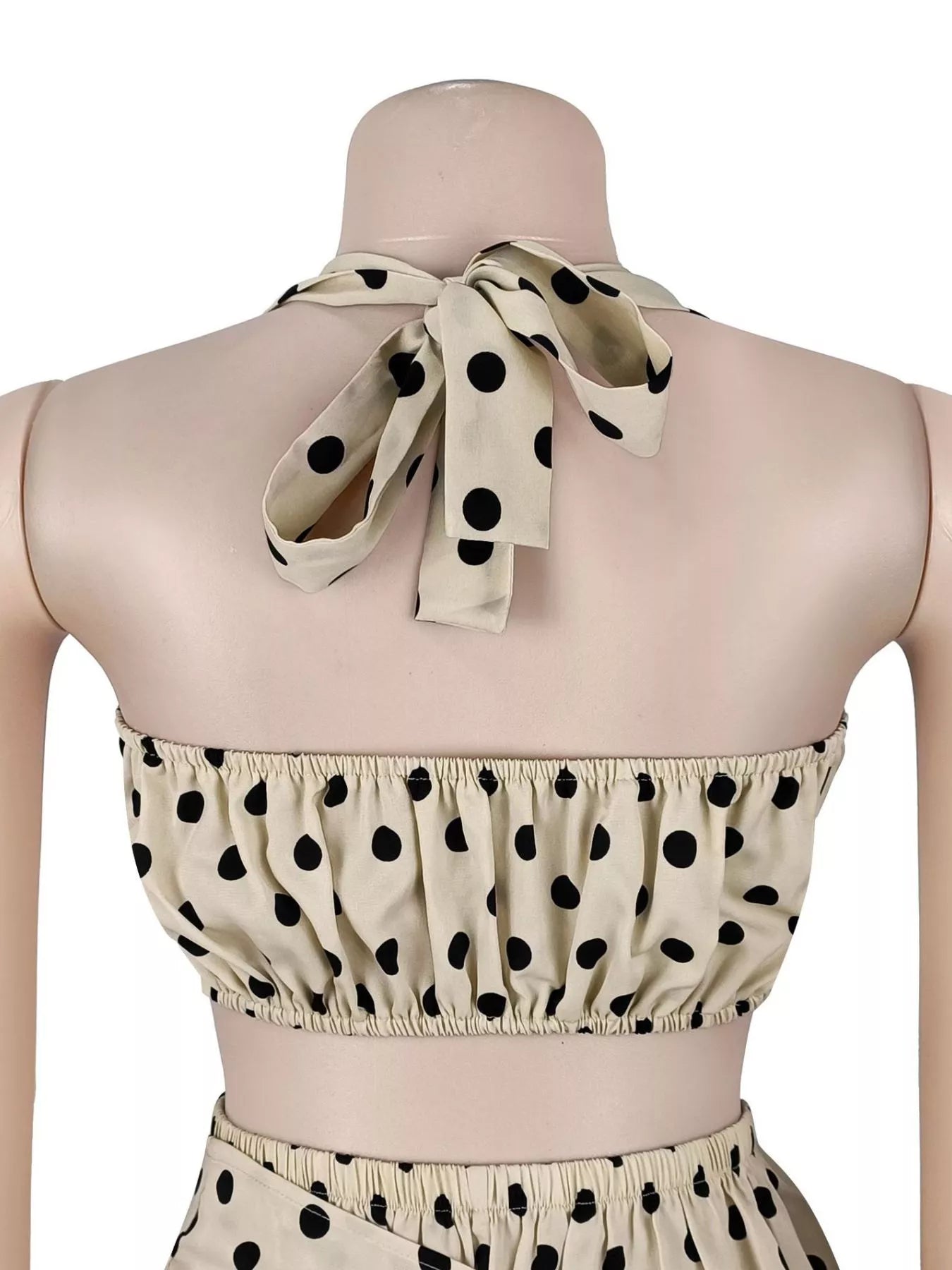 Cream polka dot halter neck cami and fringe trim pants set by Trendsi, featuring stylish top with matching flowy pants.