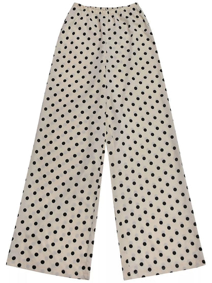 Cream polka dot halter neck cami and fringe trim pants set by Trendsi, featuring a stylish and coordinated summer outfit.