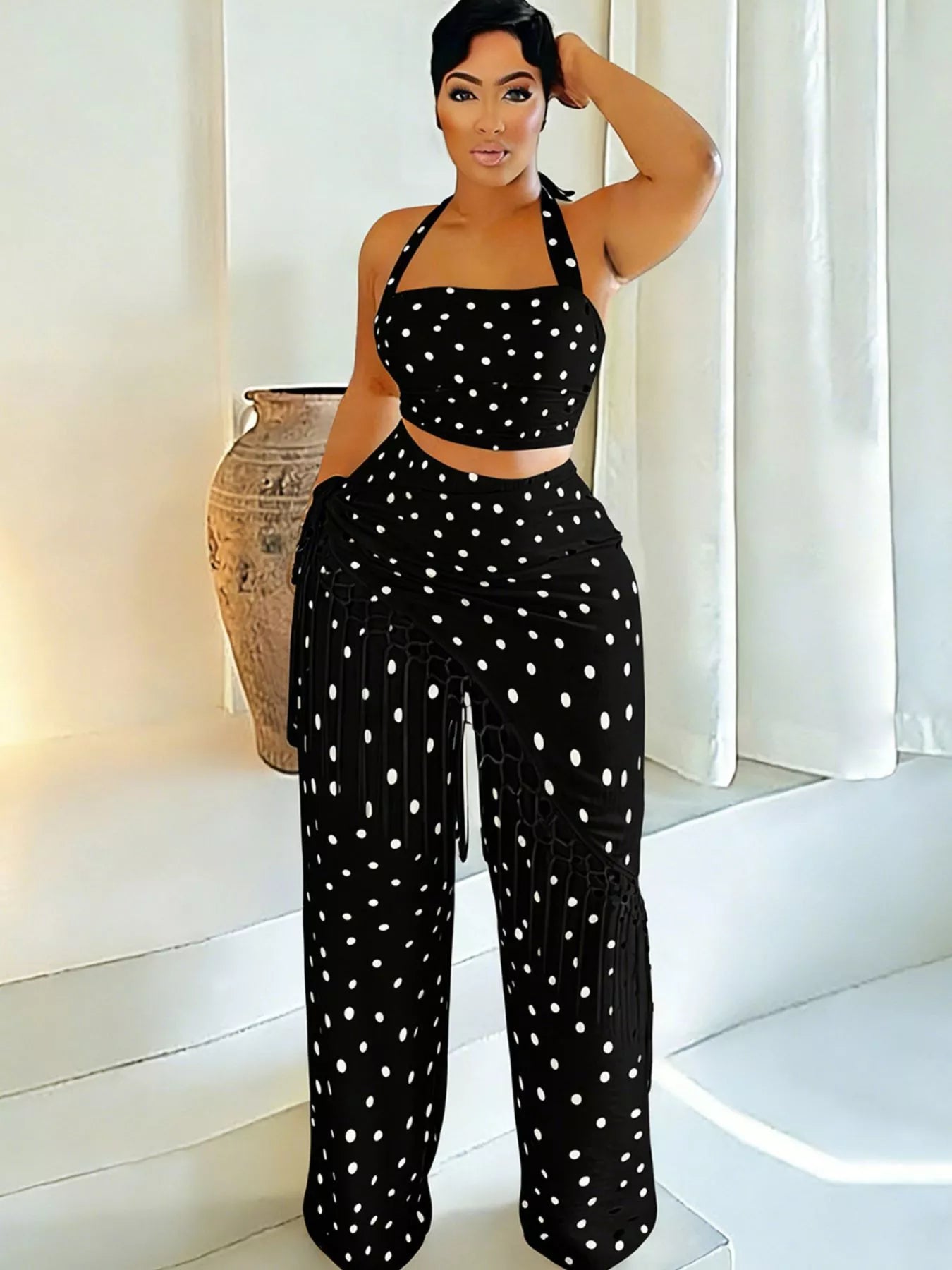 Cream polka dot halter neck cami and fringe trim pants set by Trendsi, featuring a stylish halter top and flowy pants.