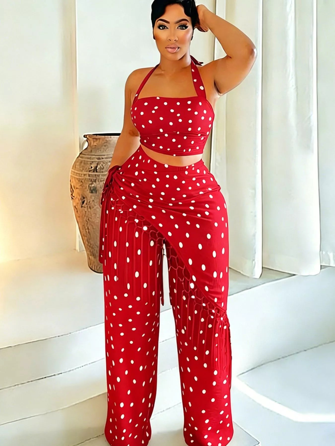 Cream polka dot halter neck cami with fringe trim pants set by Trendsi, featuring stylish details and a fashionable silhouette.