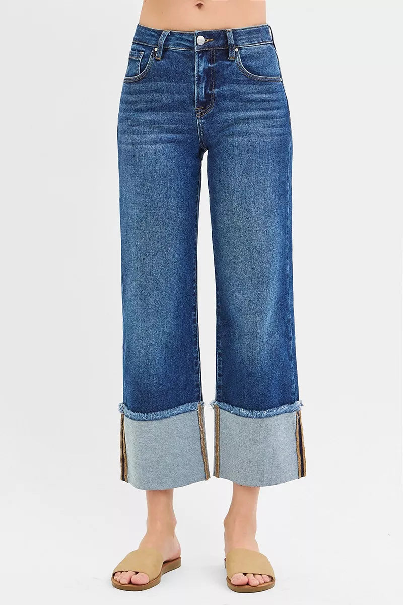 Dark denim RISEN full-size mid-rise crop wide cuffed jeans by Trendsi, plus size, with a relaxed fit and rolled-up cuffs.