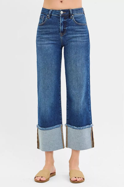 Dark denim RISEN full-size mid-rise crop wide cuffed jeans by Trendsi, plus size, with a relaxed fit and rolled-up cuffs.