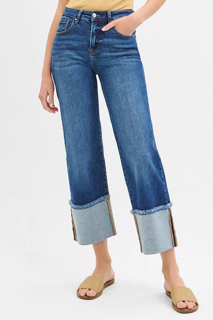 Plus size RISEN dark wash mid-rise crop wide cuff jeans with cuffed hems, styled for a trendy, relaxed fit.