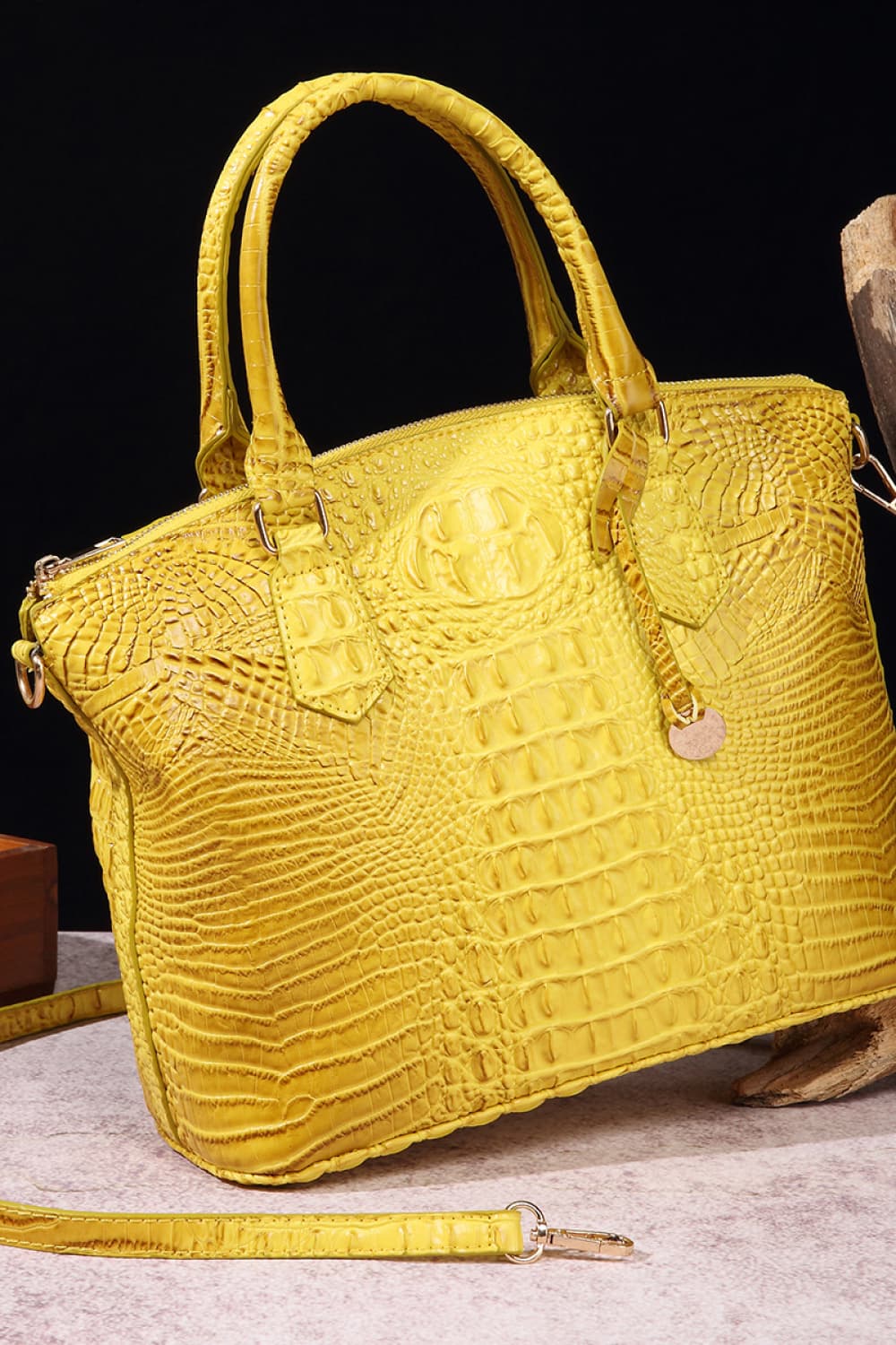 Trendsi PU leather handbag with sleek design, top handle, and silver hardware, showcasing a stylish and functional accessory.
