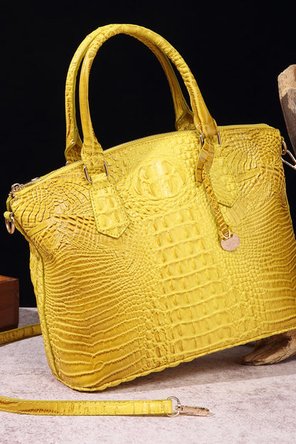 Trendsi PU leather handbag with sleek design, top handle, and silver hardware, showcasing a stylish and functional accessory.