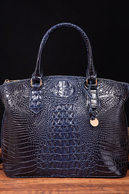 Trendsi PU leather handbag with sleek design, top handle, and silver hardware, perfect for stylish everyday use.