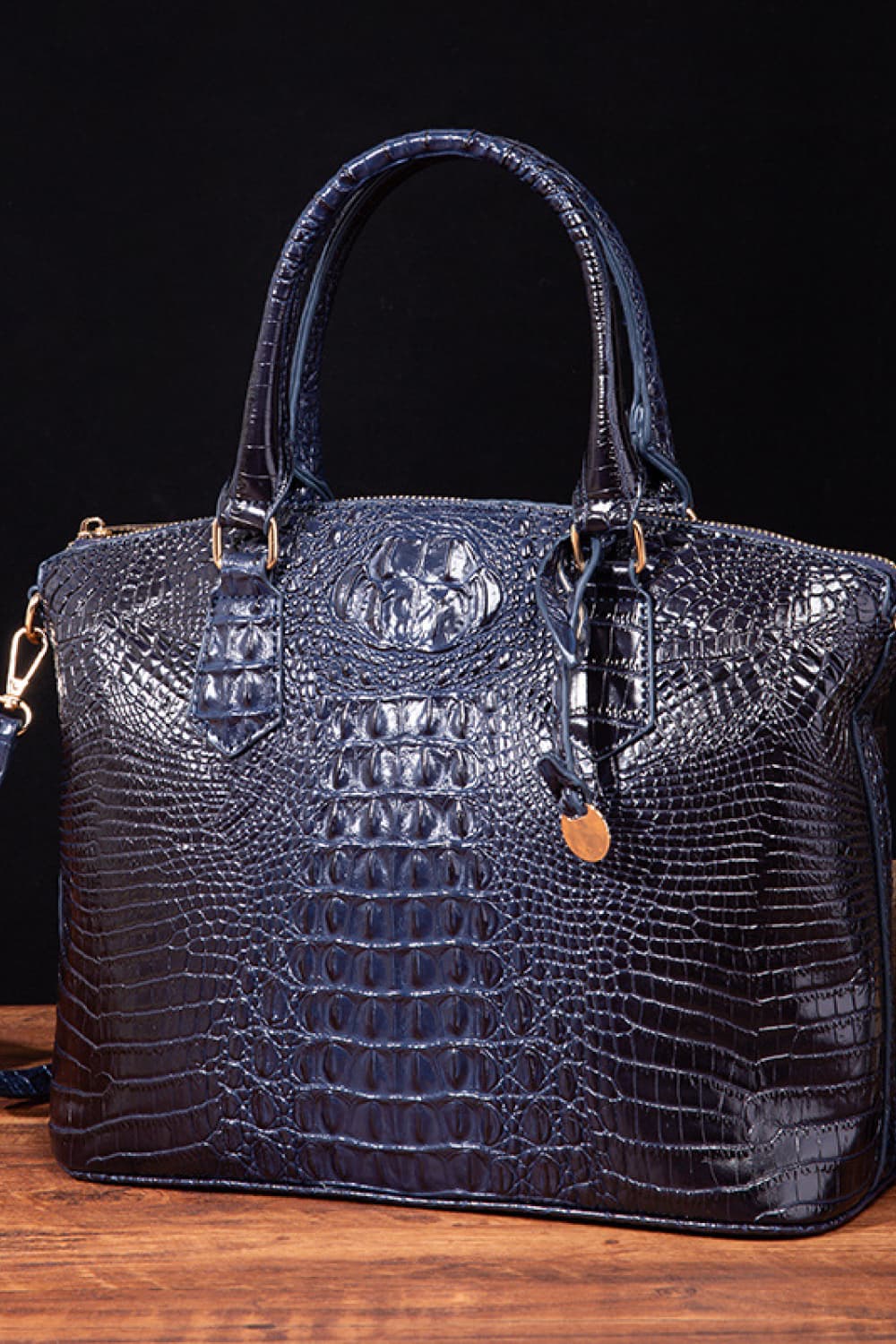 Trendsi PU leather handbag with top handles and gold-tone hardware, showcasing a sleek, stylish design on a neutral background.