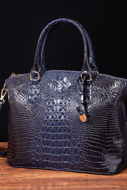 Trendsi PU leather handbag with top handles and gold-tone hardware, showcasing a sleek, stylish design on a neutral background.