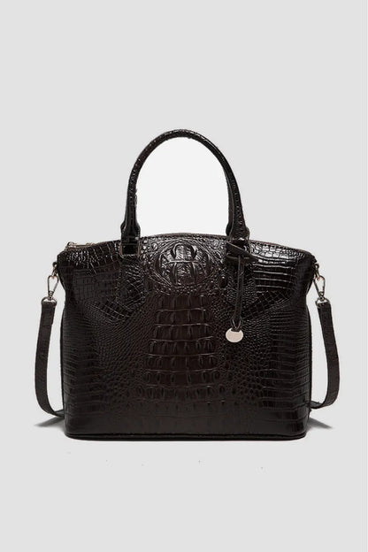 Trendsi PU leather handbag with sleek design, featuring a top handle and spacious interior for stylish everyday use.