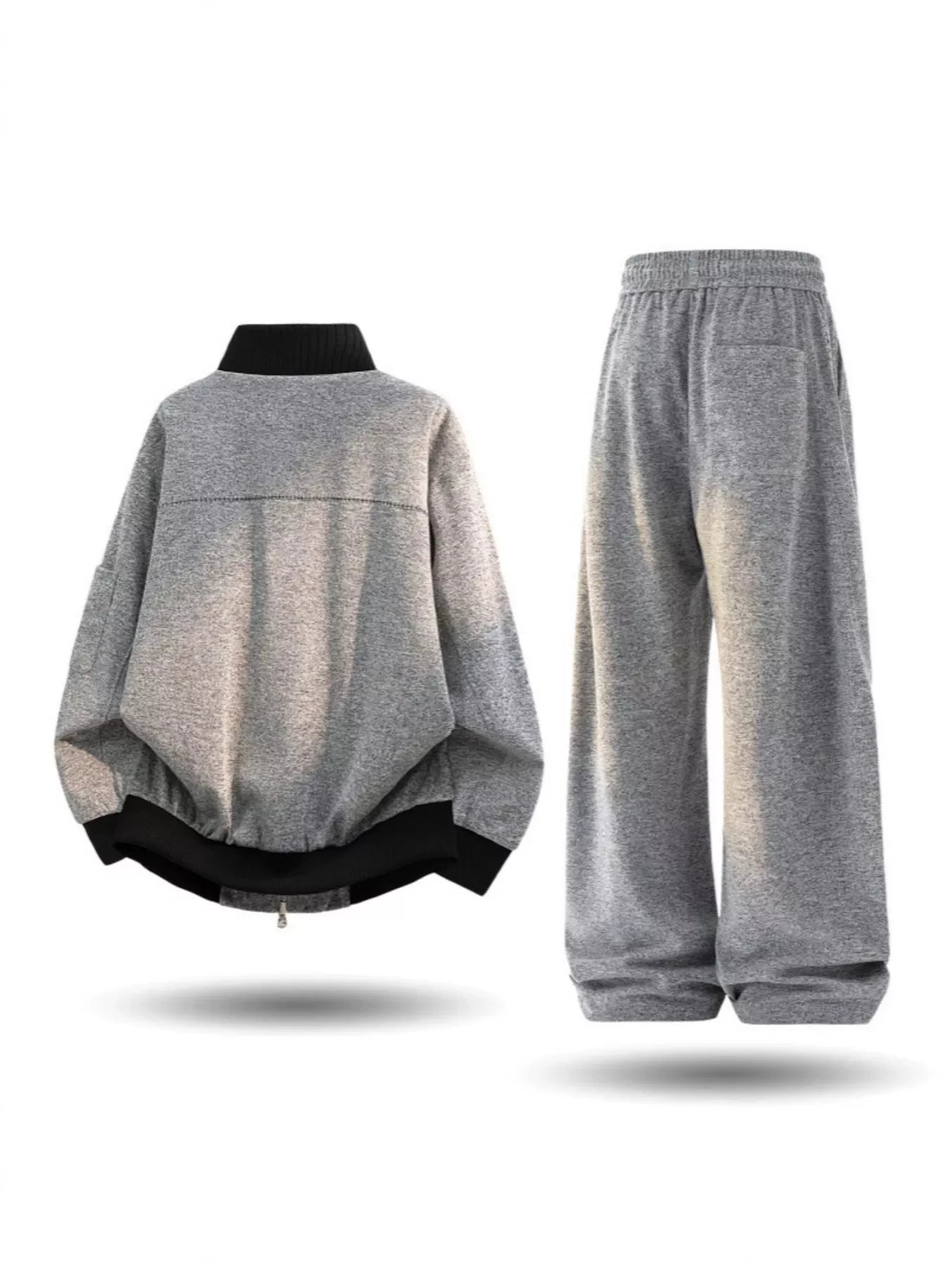 Plus size men's thick jacket and pants tracksuit set by Trendsi, featuring a cozy, casual athletic wear look in black.