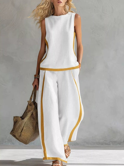Plus size contrast stripe sleeveless top and wide-leg pants set from Trendsi, featuring bold stripe design and comfortable fit.