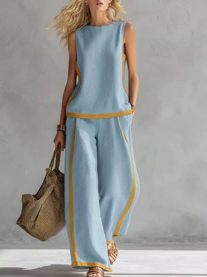 Plus size contrast stripe sleeveless top and wide-leg pants set by Trendsi, featuring bold stripes and a stylish, relaxed fit.