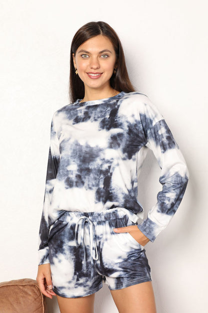 Dark gray shiny tie-dye lounge set with round neck top and matching shorts by Trendsi, perfect for comfortable casual wear.