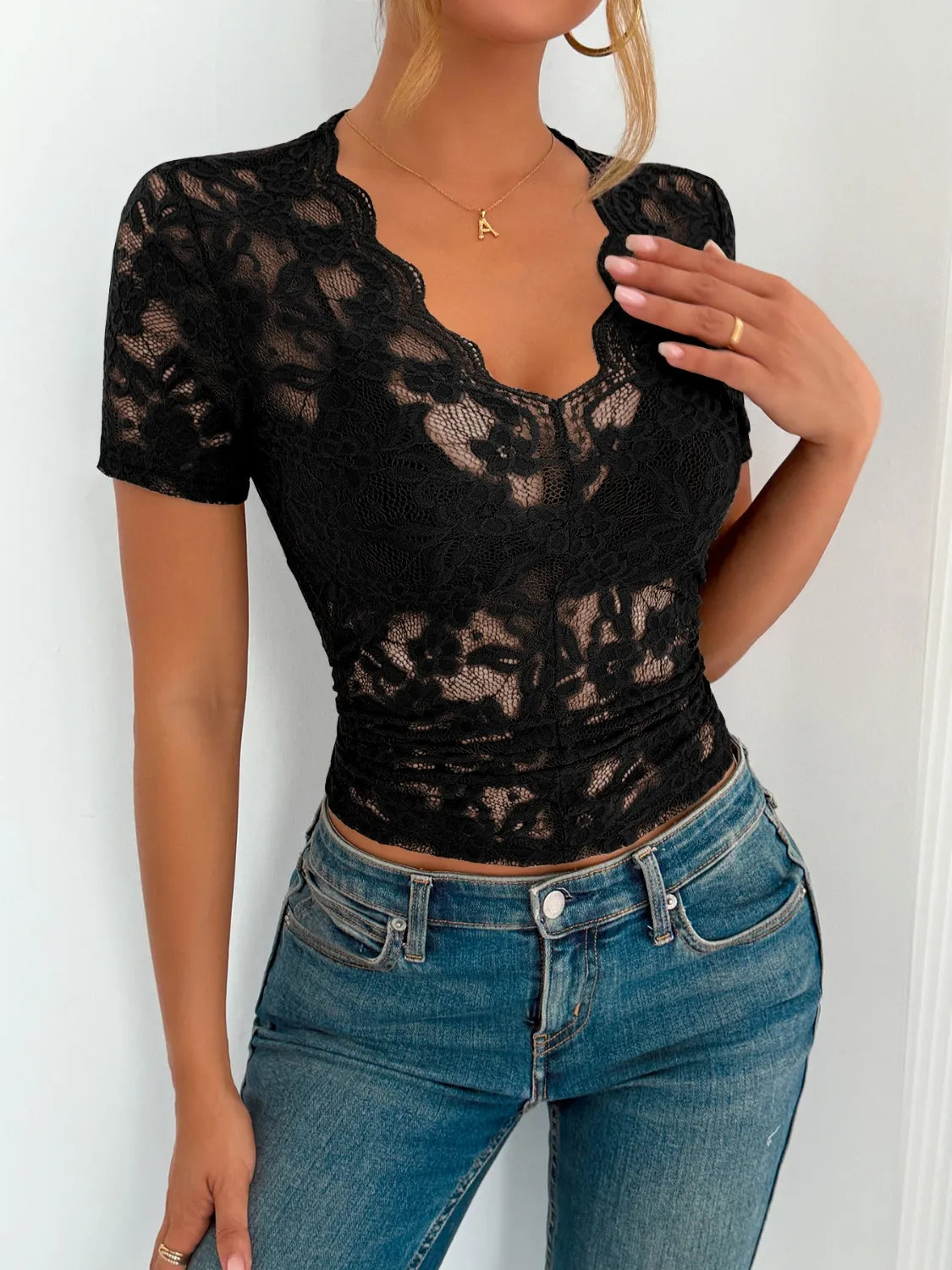 Dark green lace V-neck short sleeve top by Trendsi, featuring a delicate lace design and a flattering V-neckline.