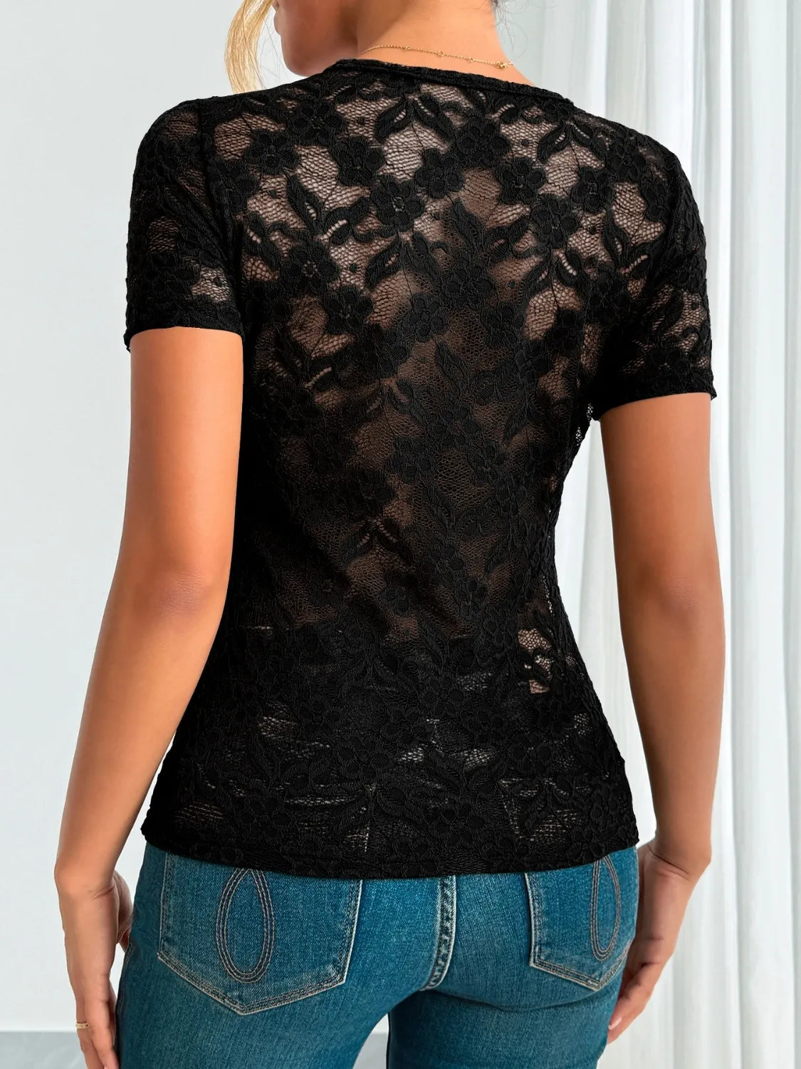 Dark green lace V-neck short sleeve top from Trendsi, featuring intricate lace fabric and a stylish, fitted design.