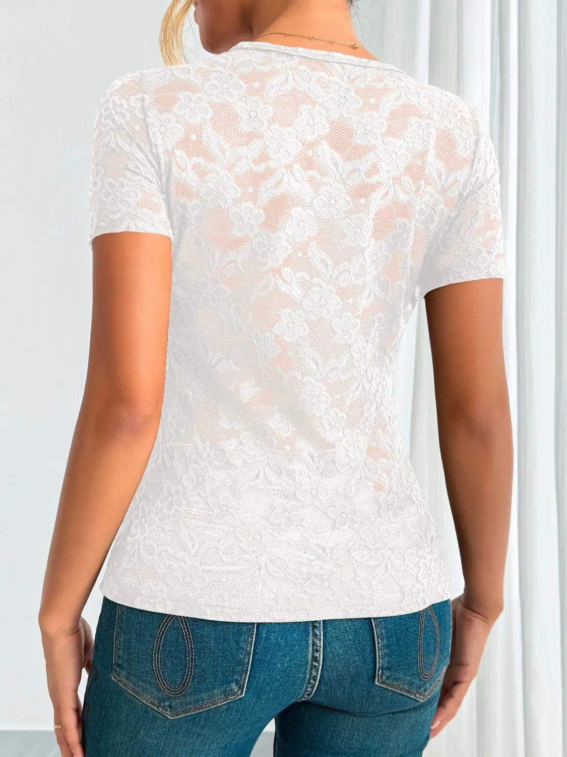 Dark green lace V-neck short sleeve top from Trendsi, featuring delicate lace fabric and a stylish V-neck design.