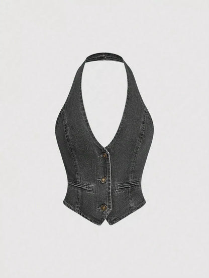 Dark denim halter neck vest and wide-leg jeans set by Trendsi, featuring a stylish sleeveless vest and flowy pants.